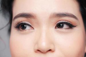 Young woman with beautiful eyebrow, closeup photo