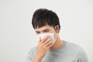 Asian man wearing a face mask with coughing photo