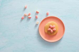 Children's breakfast or dessert - pancake with marshmallow candies. photo