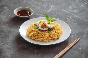 Dry instant noodle - asian ramen and vegetables for the soup photo