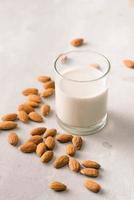Almond milk in glass. Organic healthy snack vegan vegetarian photo