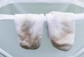 dirty stain on socks from using in daily life activity for cleaning concept. selective focus image. photo