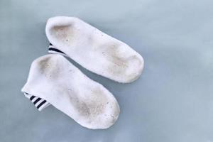 dirty stain on socks from using in daily life activity for cleaning concept. selective focus image. photo