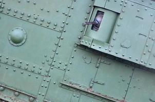 Abstract green industrial metal textured background with rivets and bolts photo