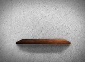 Top view of wood shelves on concrete wall texture background with clipping path for design photo