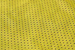 Texture of sportswear made of polyester fiber. Outerwear for sports training has a mesh texture of stretchable nylon fabric photo