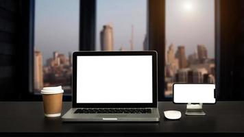 Front view workspace with computer, smartphone and tablet on white desk photo