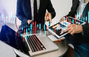 Trading growth graph on business and investment and finance business analysis stockmarket with digital tablet.digital technology background. photo