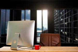 workspace with computer, laptop, office supplies, and coffee cup, smartphone, and tablet at office. desk work concept. photo