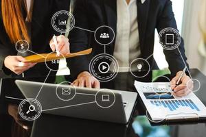 Digital marketing media website ad,social network, SEO, mobile app in virtual screen.business hand working on laptop photo