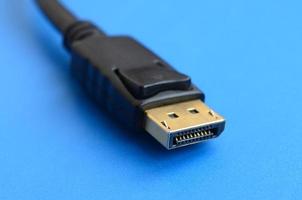 20-pin male DisplayPort gold plated connector for a flawless connection on a blue background photo