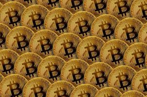 Pattern of many golden bitcoins. Cryptocurrency mining concept photo