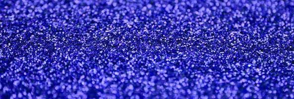 Blue decorative sequins. Background image with shiny bokeh lights from small elements photo