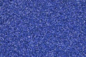 Blue decorative sequins. Background image with shiny bokeh lights from small elements photo