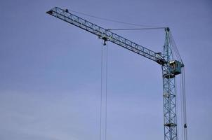 Tower crane against a blue sky photo