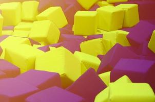 Many colorful soft blocks in a kids' ballpit at a playground photo