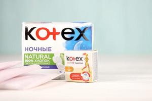 KHARKIV, UKRAINE - DECEMBER 16, 2021 Kotex production with logo. Kotex is a brand of feminine hygiene products, includes maxi, thin and ultra thin pads. photo