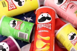 KHARKIV, UKRAINE - DECEMBER 16, 2021 Pringles product with new logo. Pringles is a brand of potato snack chips owned by the Kellogg Company photo