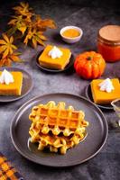 Autumn homemade pumpkin spice waffles with honey topping. photo