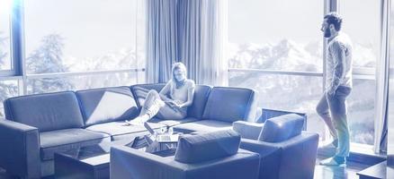 couple relaxing at  home using tablet computer photo