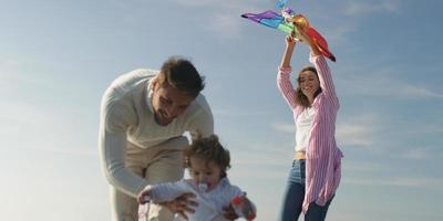 Young family enjoying vecation during autumn photo