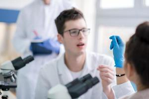 Group of young medical students doing research photo