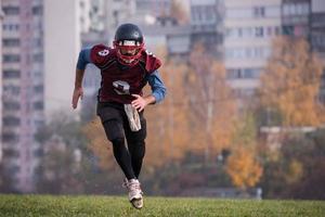 american football player in action photo