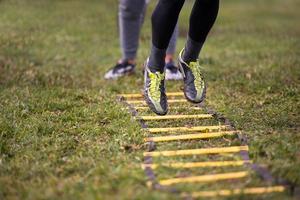 american football player exercises on ladder drills photo