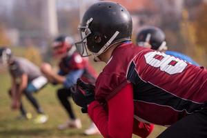 american football players stretching and warming up photo