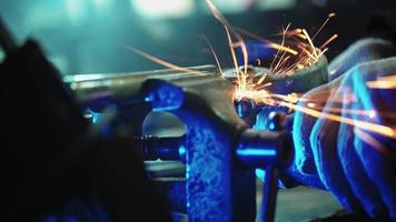 Professional Mechanic Cuts Off Metal Pipe with a Grinder. Man Works with Circular Saw. Sparks Flying from the Place of Cutting Metal. Steel Industry Concept. Unrecognizable Person. video