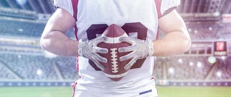 closeup American Football Player isolated on big modern stadium photo