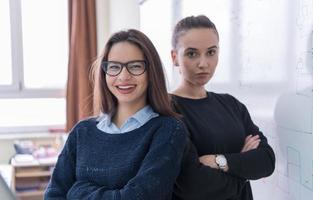 portrait of two young female students photo