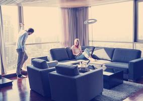 couple relaxing at  home using tablet computer photo
