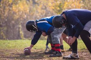 american football team in action photo