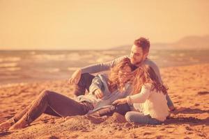 Young family enjoying vecation during autumn photo