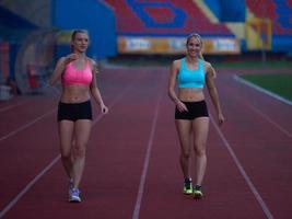 Female Runners Finishing Race Together photo