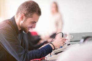 students doing practice in the electronic classroom photo