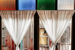 Close up of old vintage style and antique wooden window in Thailand. photo