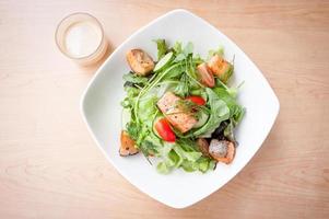 Salmon salad with cream on table photo