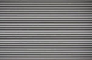 The texture of the shutter door or window in light gray color photo