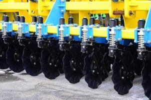 Spring system of agricultural seeder close up photo