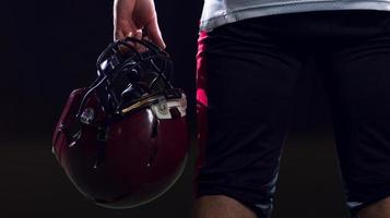 rear view of young confident American football player photo