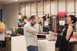 couple chooses shoes At Shoe Store photo