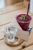 Blueberry smoothie on the table and blank card soft focus point photo