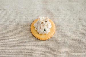 Cracker with tuna spread topping photo