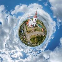 little planet transformation of spherical panorama 360 degrees. Spherical abstract aerial on church. Curvature of space. photo