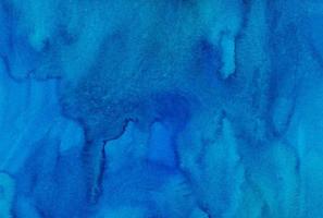 Watercolor deep azure blue background texture. Hand painted watercolour backdrop. Sky blue stains on paper. photo