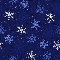 Seamless pattern with snowflakes of different shapes and sizes on a blue background. Vector graphics.