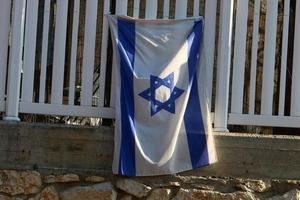 The blue and white flag of Israel with the six-pointed Star of David. photo