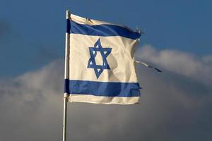 The blue and white flag of Israel with the six-pointed Star of David. photo